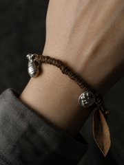 Handmade Plant-Dyed Braided Bracelet with Tibetan Charms