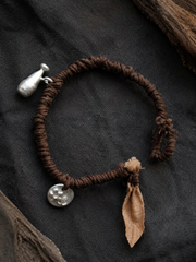 Handmade Plant-Dyed Braided Bracelet with Tibetan Charms
