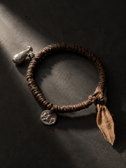 Handmade Plant-Dyed Braided Bracelet with Tibetan Charms